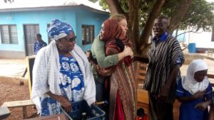 Sarah Williamson hugging Sadia Inusah the school librarian.